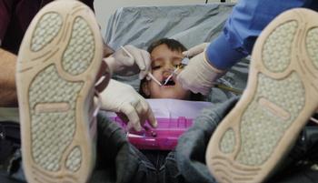 Dentist Checks Children